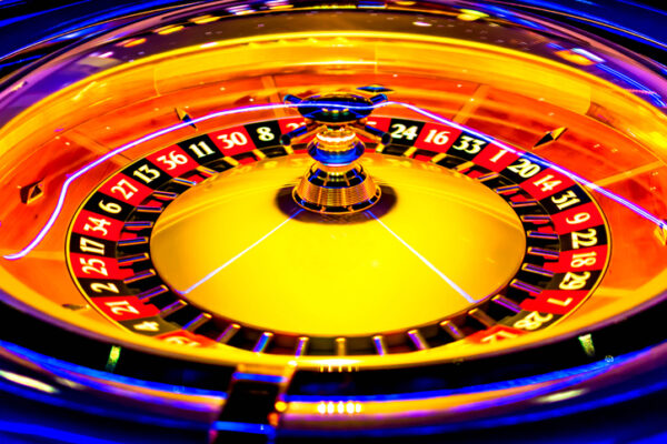 Yellow Roulette wheel in casino.