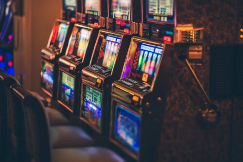 Four Slot machines in a row. Article about slots tips and tricks.