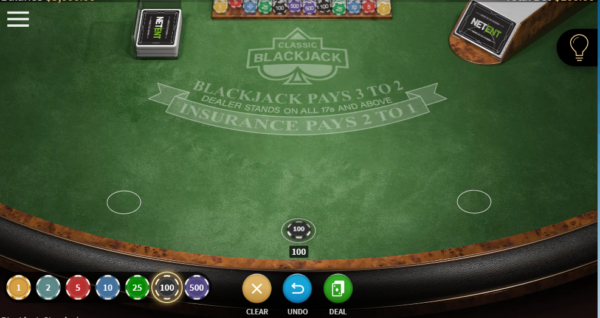 Green blackjack table player playing blackjack side bets