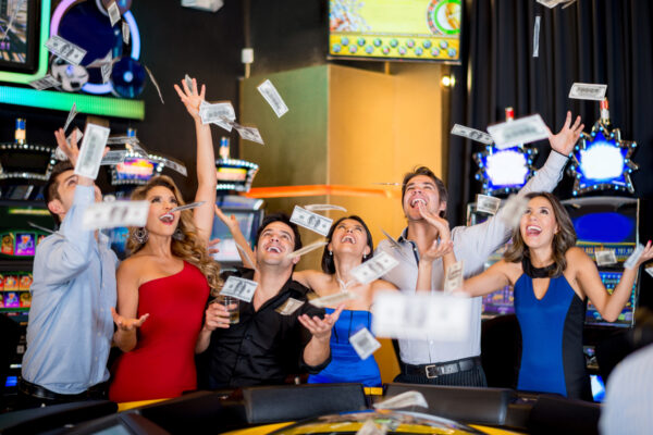 image of seven people in a casino cheering after a baccarat wins