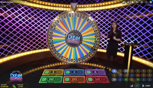 a women spinning a big wheel, hosting a dream catcher live game online casino