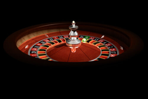 Roulette wheel in a dark casino