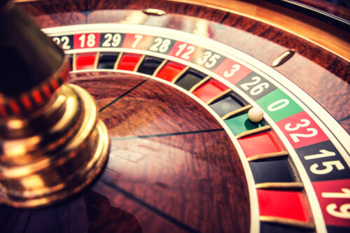 Roulette wheel in casino with ball on green position zero. Using the martingale betting strategy roulette at resorts casino