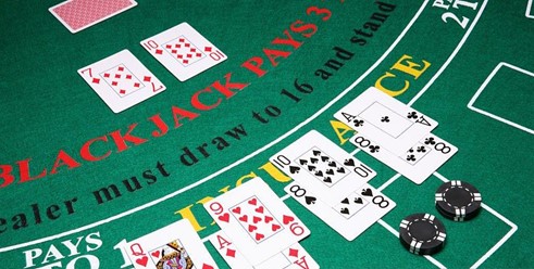 an image of a blackjack where players hit or stand