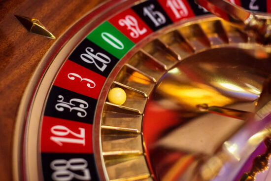 detail shot of a french lightening roulette wheel. focus on ball in number 3.